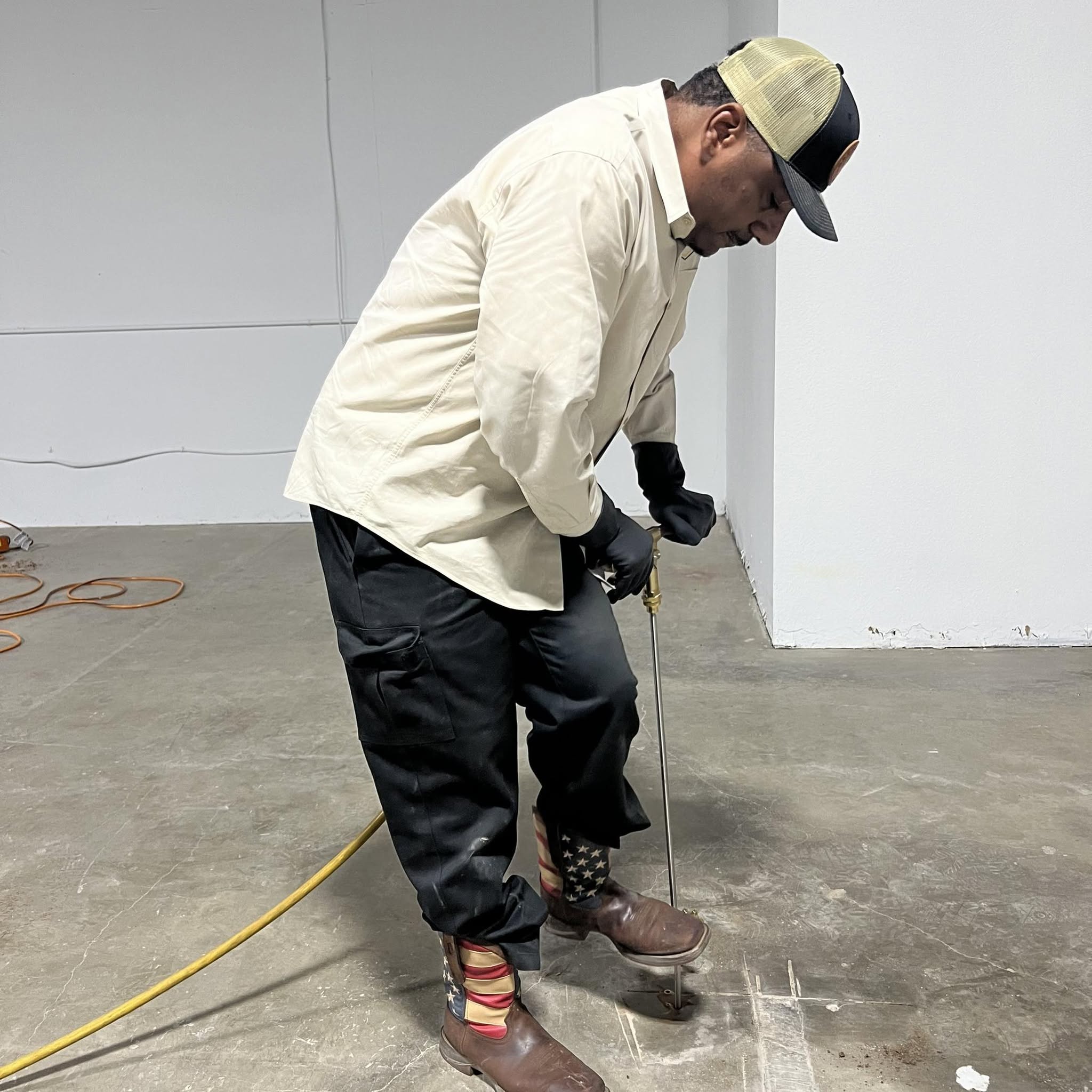 Definity technician spraying a pest barrier treatment
