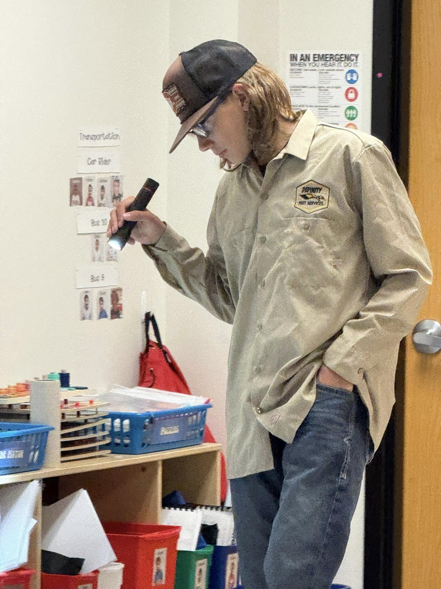 Employee examining inside building for pests (2)