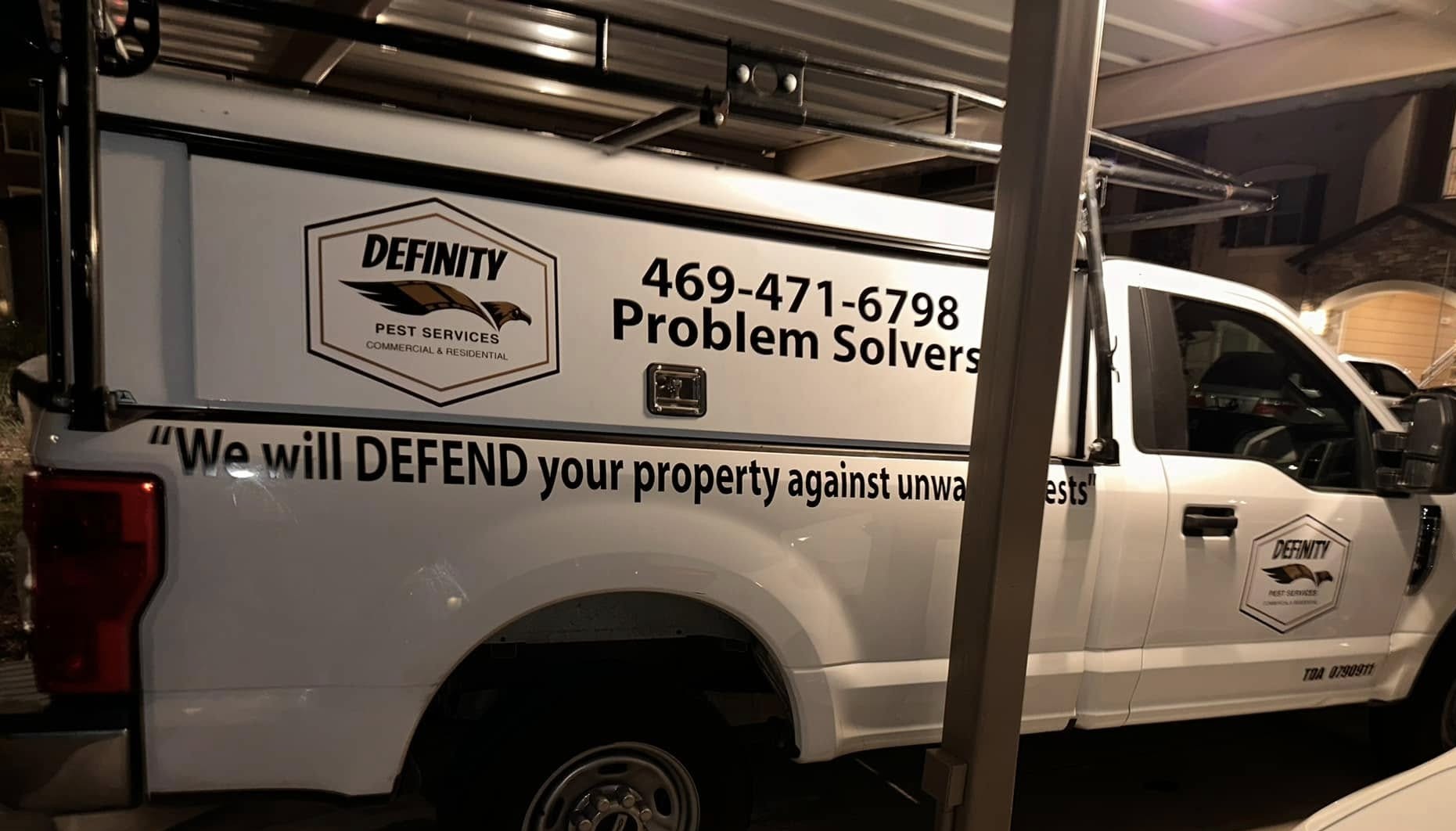Definity Pest Services work truck — eagle-branded fleet