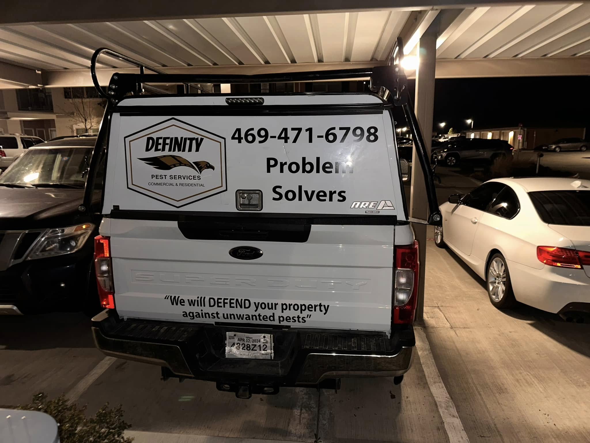 Definity Pest Services work truck — eagle-branded fleet